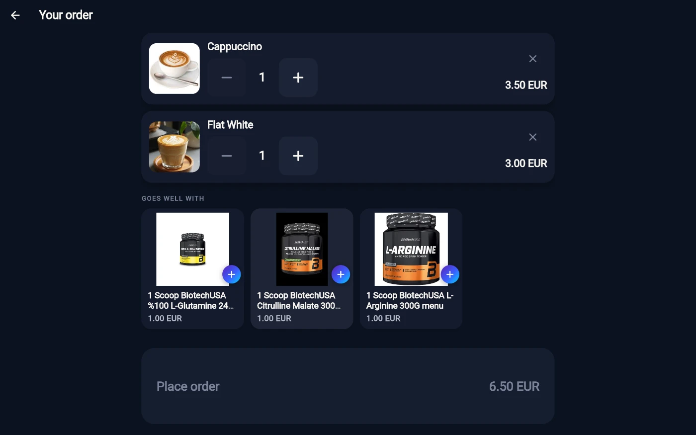 The Your order checkout after signing in: a Cappuccino line at 3.50 EUR and a Flat White line at 3.00 EUR, each with a minus/plus quantity stepper and a remove cross, a GOES WELL WITH strip of three 1.00 EUR supplement suggestions with add buttons, and a Place order bar showing the 6.50 EUR total.