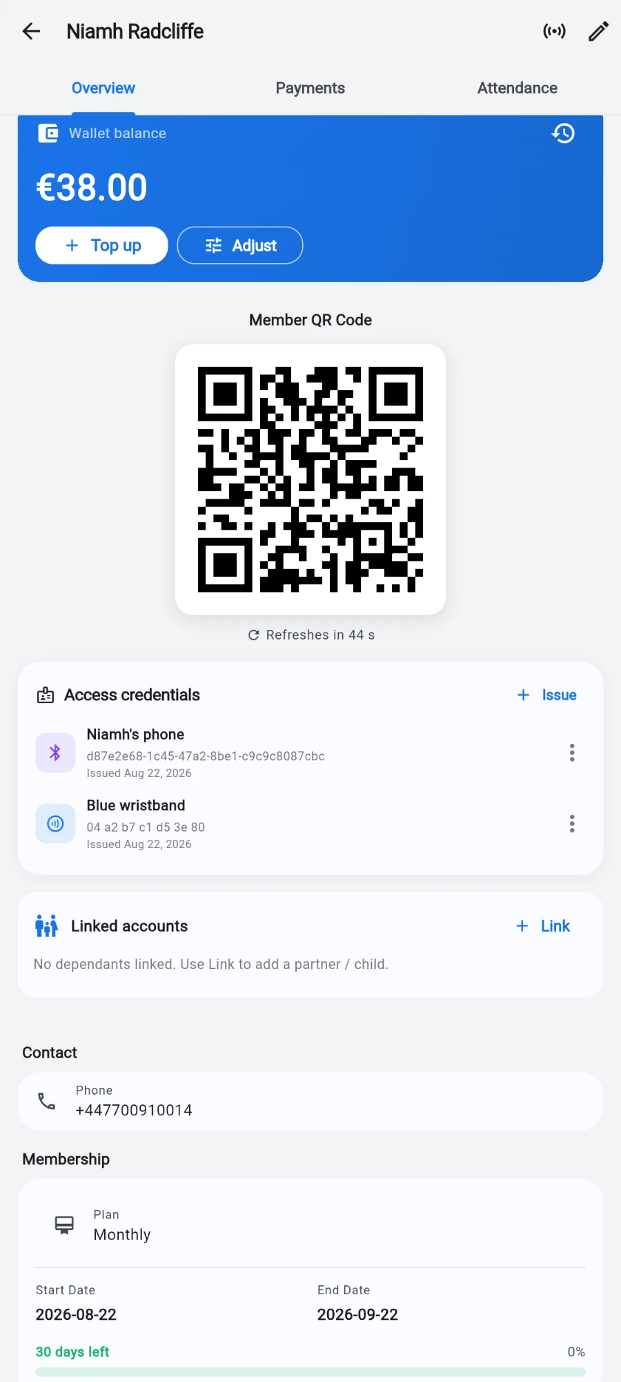 Niamh Radcliffe's profile scrolled to the Access credentials card, listing a Bluetooth credential labelled 'Niamh's phone' with its member id and 'Issued Aug 22, 2026', and an NFC credential labelled 'Blue wristband' with the UID 04 a2 b7 c1 d5 3e 80 and the same issue date — each with an overflow menu. Neither has been used at a door yet, so no last-used time is shown. The rotating member QR code sits above and Linked accounts below