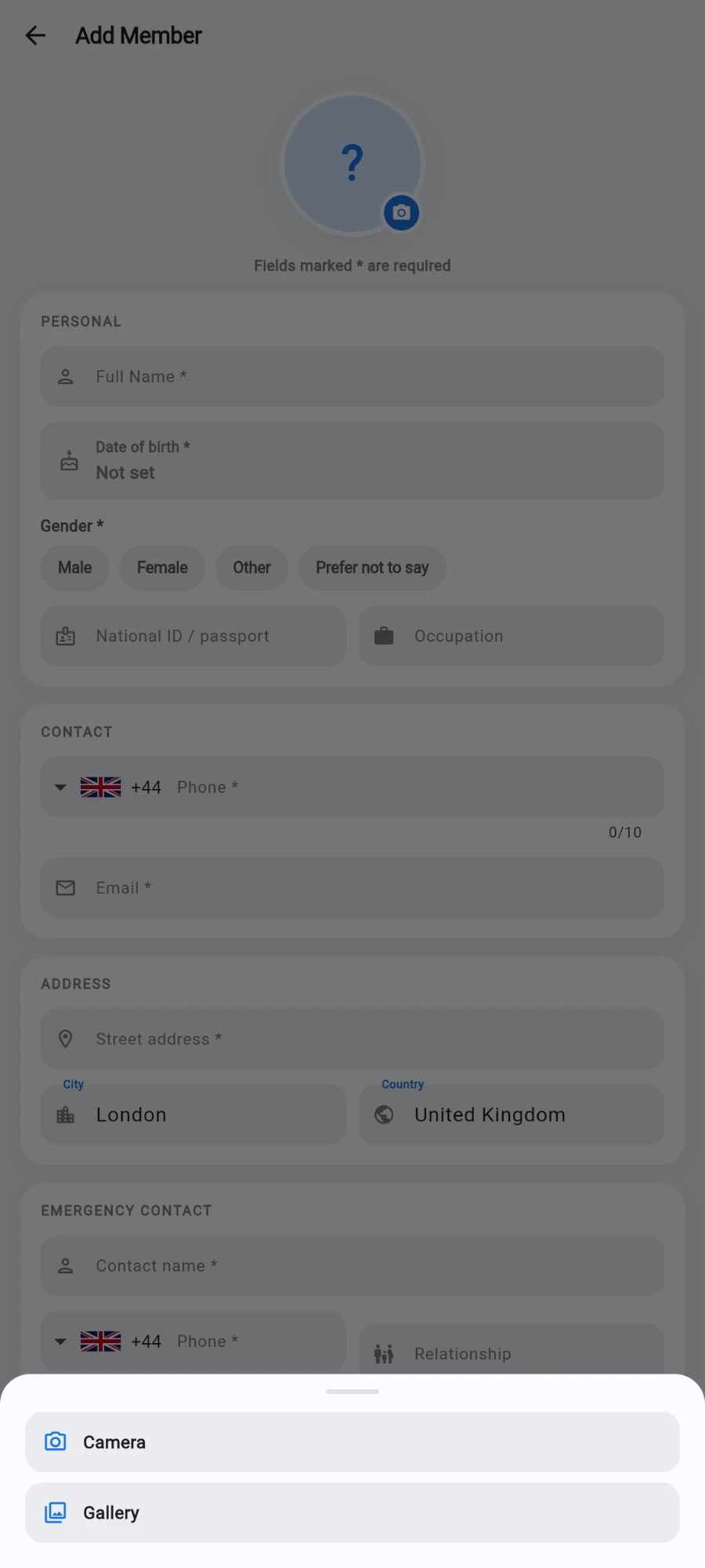 The Add Member form dimmed behind a bottom sheet offering two choices, Camera and Gallery, after tapping the photo circle at the top of the form