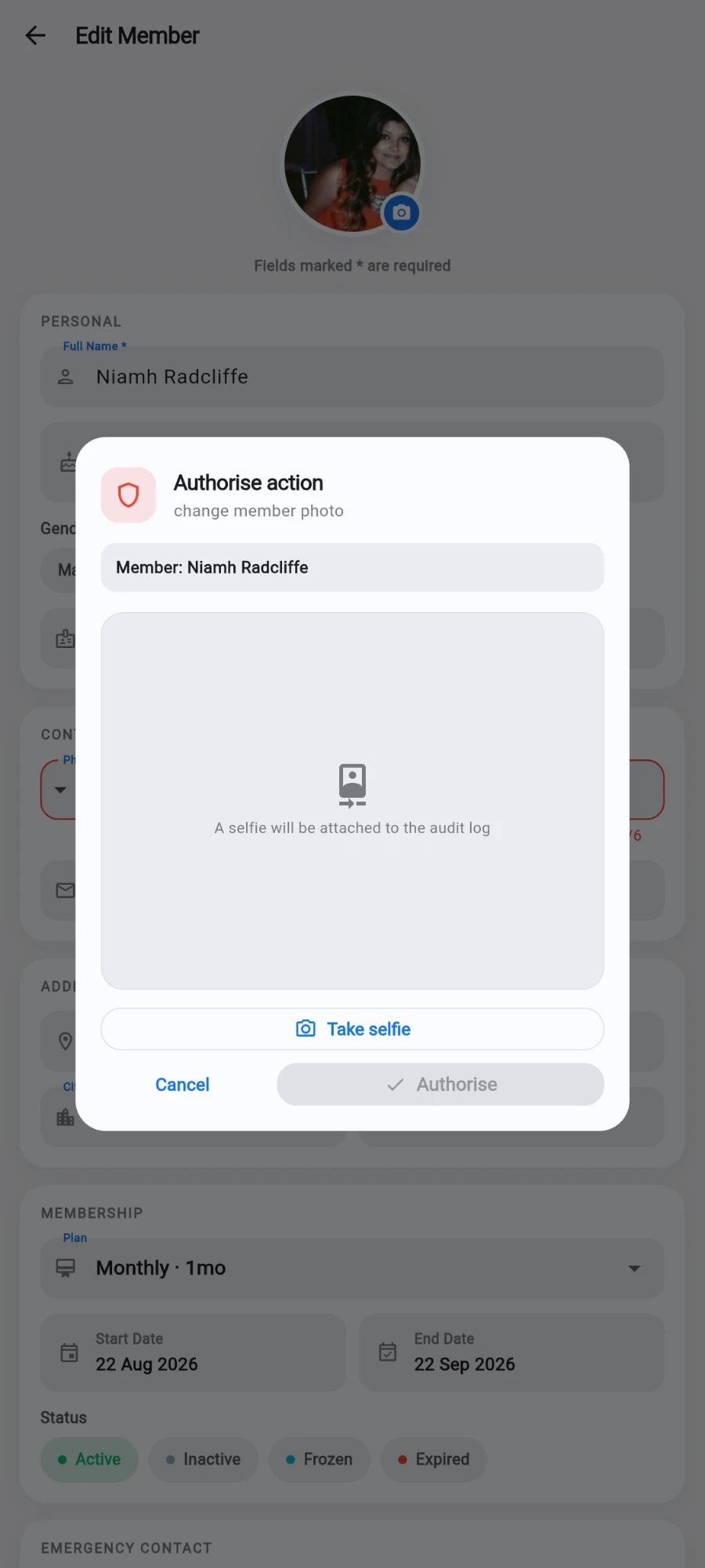 The Edit Member form dimmed behind an 'Authorise action — change member photo' dialog: a Member row naming the member, an empty preview panel reading 'A selfie will be attached to the audit log', a Take selfie button, and Cancel next to an Authorise button that is still greyed out