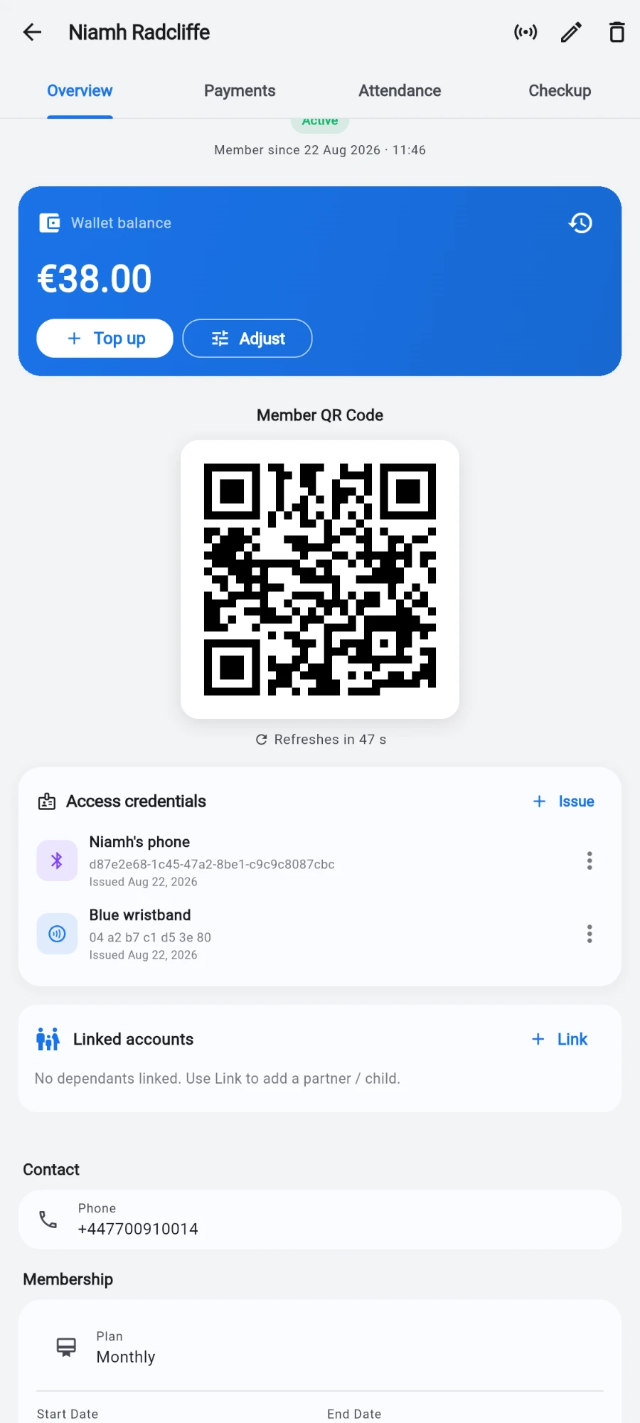 A member profile scrolled to the blue Wallet balance card showing €38.00 with Top up and Adjust buttons and a history clock icon top right, above the member QR code, the Access credentials card listing a phone key and an NFC wristband, and the Linked accounts card