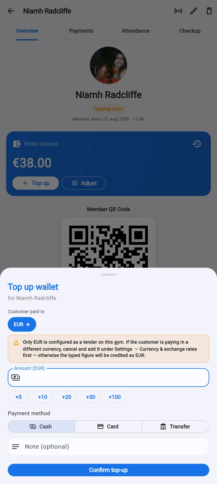 The Top up wallet sheet with the Customer paid in currency chip and the amount field