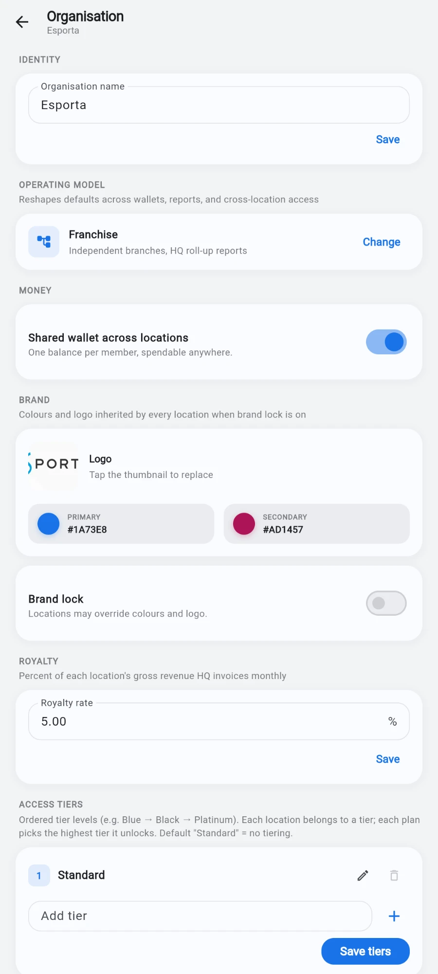 The Organisation screen showing Identity with the organisation name, Operating model set to Franchise with a Change link, and Money with the Shared wallet across locations switch on