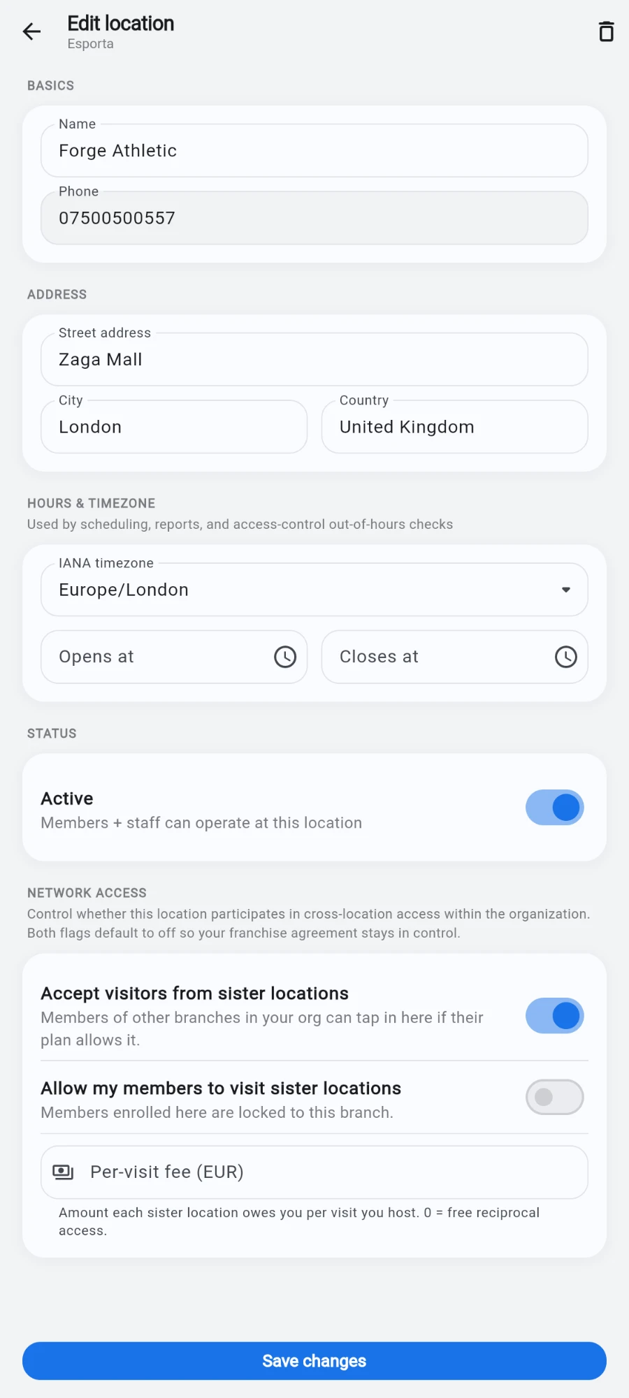 The Edit location form for Forge Athletic: Basics with name and phone, Address (Zaga Mall, London, United Kingdom), Hours & timezone set to Europe/London, and the Active status switch