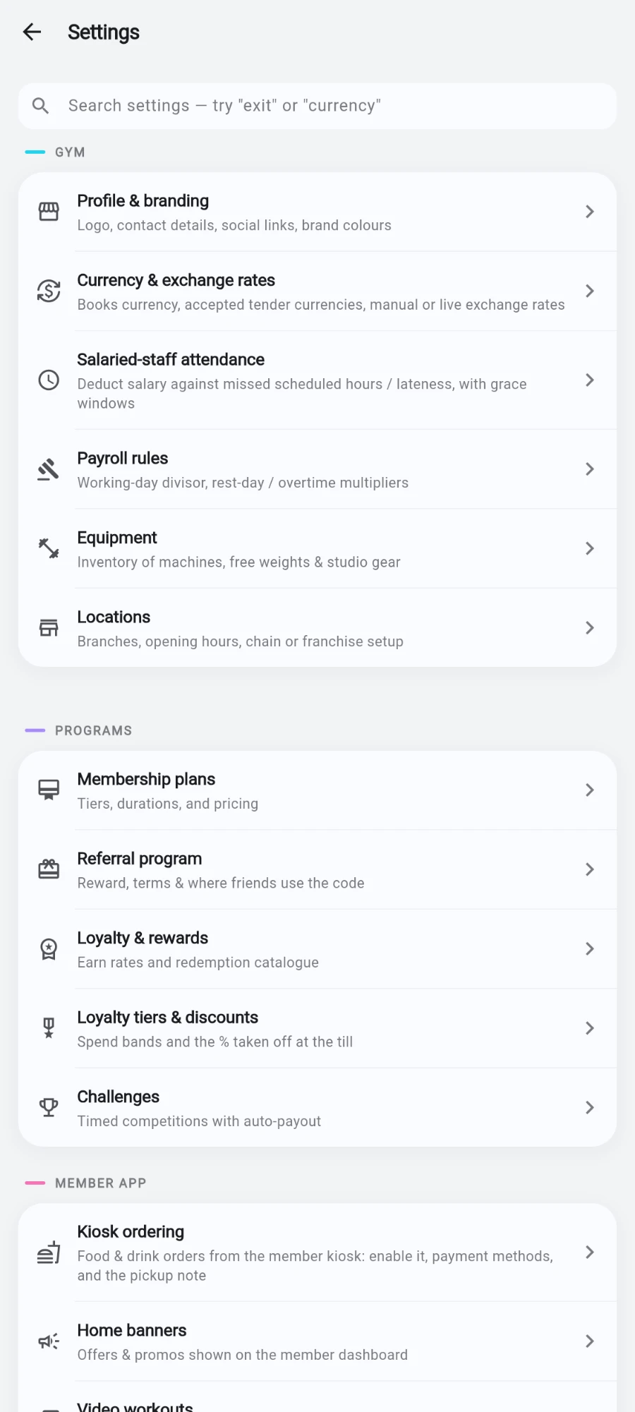 The Settings hub: the 'Search settings — try exit or currency' field at the top, then the GYM group (Profile & branding, Currency & exchange rates, Salaried-staff attendance, Payroll rules, Equipment, Locations) and the start of PROGRAMS