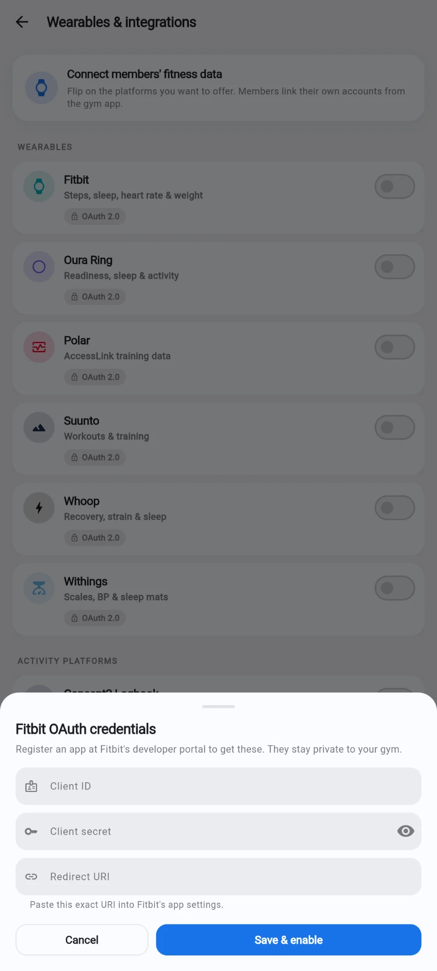 The Fitbit OAuth credentials sheet — Register an app at Fitbit's developer portal to get these. They stay private to your gym — with empty Client ID, Client secret and Redirect URI fields, the note Paste this exact URI into Fitbit's app settings, and Cancel / Save & enable