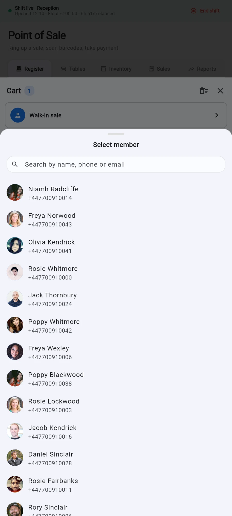 The Select member sheet sliding over the cart, with a search-by-name-phone-or-email field above a list of members with photos and phone numbers